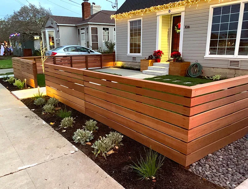 Redwood fence with a flat cap rail