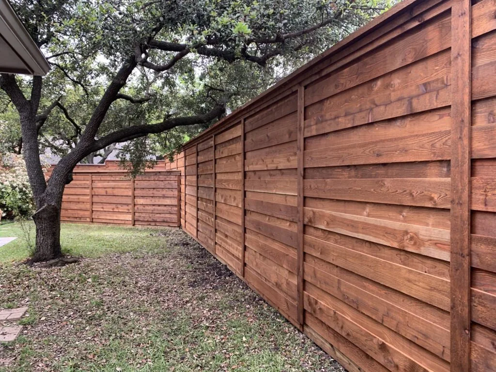 Wood privacy fence along a property line